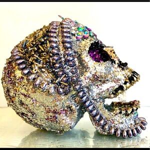 Objet d’art 1 of uniquely embellished skull.